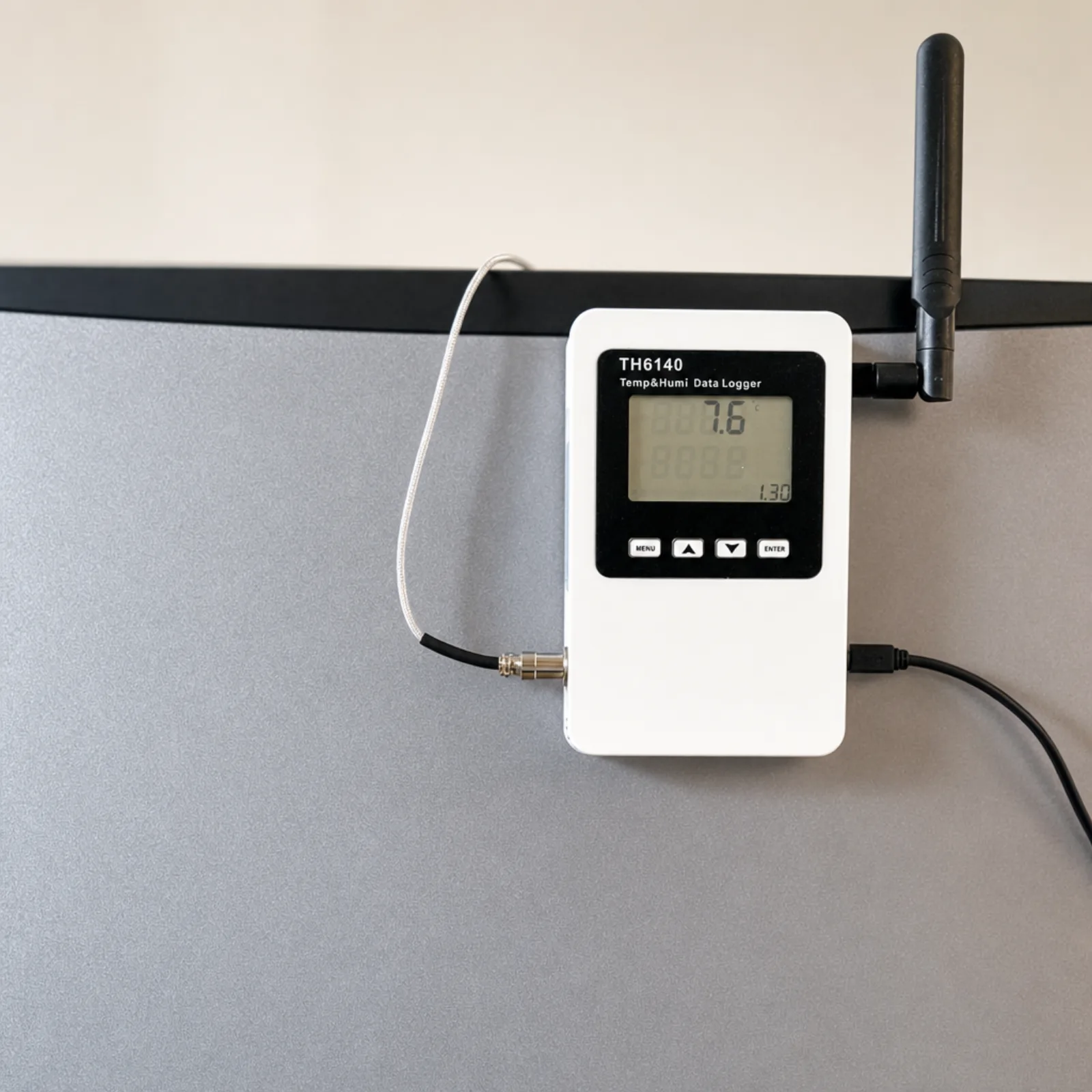 device on the fridge door, display in range